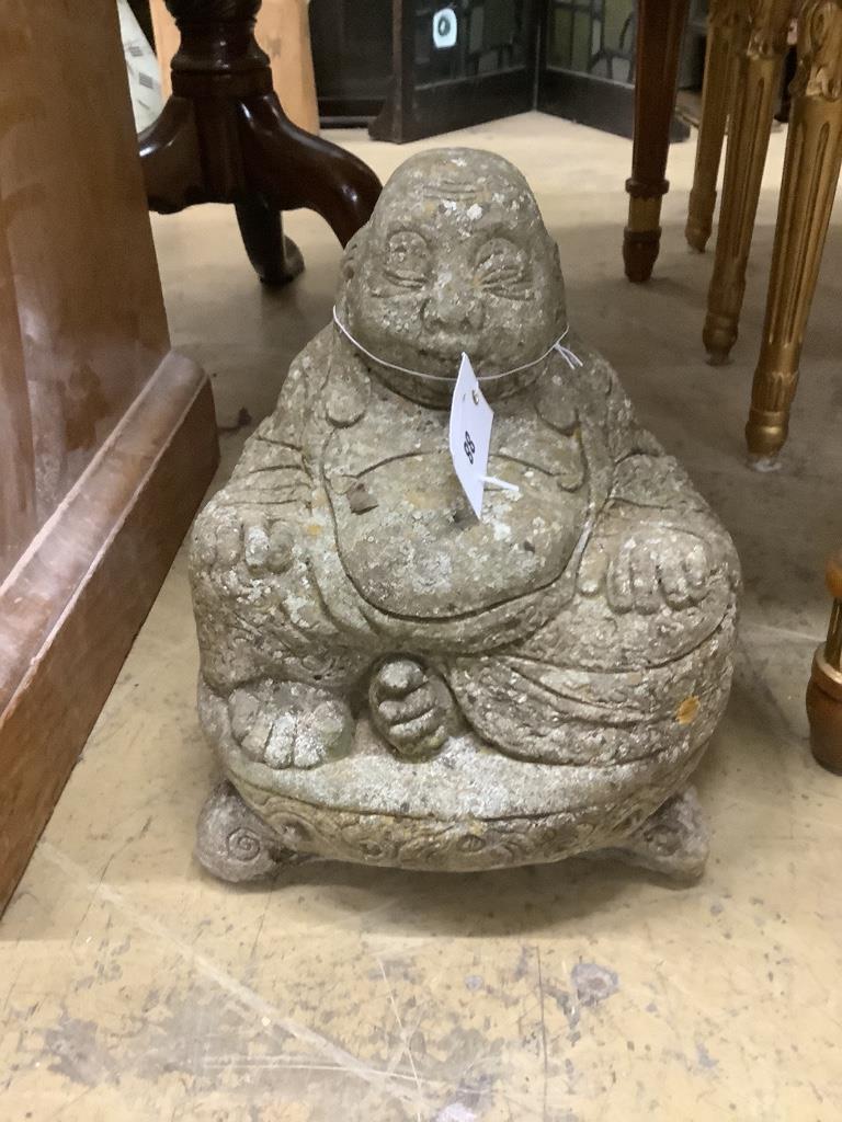 A reconstituted stone Buddha garden ornament, height 28cm